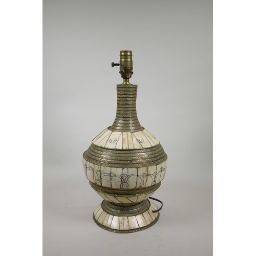 8 - An Indian mixed metal and bone lamp with chased and painted decoration, 18