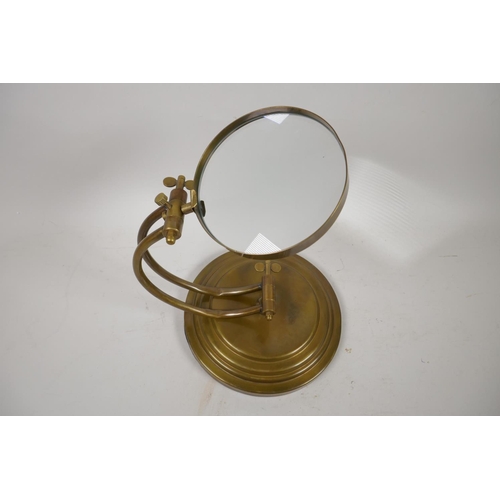 9 - A brass desk top magnifying glass, 9