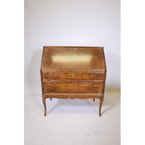 1859 - An early C20th Swedish birch veneered bureau with a fitted interior over two long drawers, 35