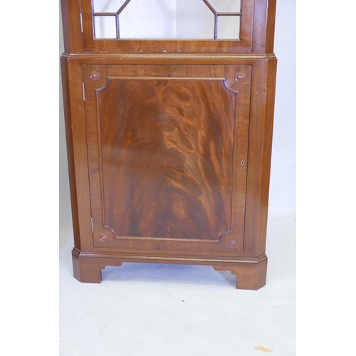 1175 - A good pair of Regency style figured mahogany corner display cabinets, the tops with astragal glazed... 