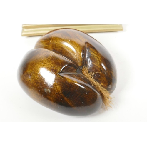 1 - A carved wood model of a coco de mer, 6½