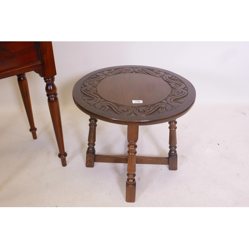 1168 - A hardwood single drawer side table and an oak occasional table with carved top, raised on turned su... 