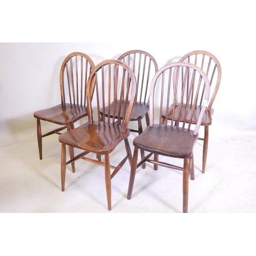 1170 - A matched set of five hoop back chairs, some with elm seats