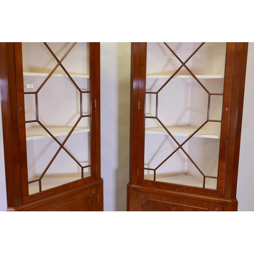 1175 - A good pair of Regency style figured mahogany corner display cabinets, the tops with astragal glazed... 