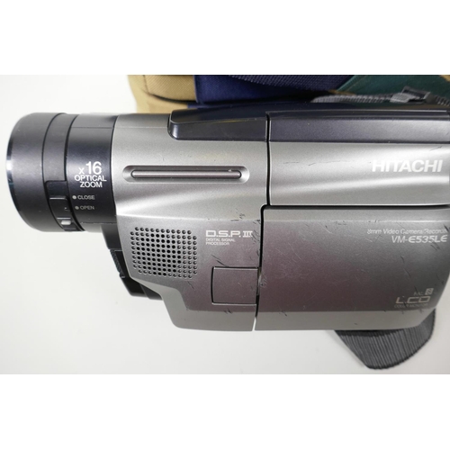 13 - A Hitachi VM-E535LE digital video camera with charger, remote etc in a Benetton carry case