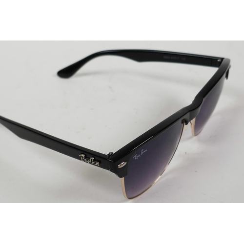 18 - A pair of RayBan sunglasses with black frames and mauve tinted glass in a Lipsy of London hard case