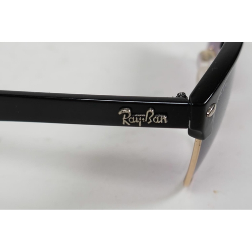 18 - A pair of RayBan sunglasses with black frames and mauve tinted glass in a Lipsy of London hard case