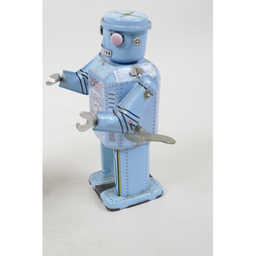 20 - A Chinese tin plate walking toy robot, 5