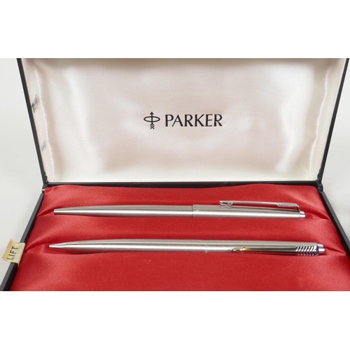 22 - A Sheaffer fountain pen together with a Parker ball point pen and pencil set