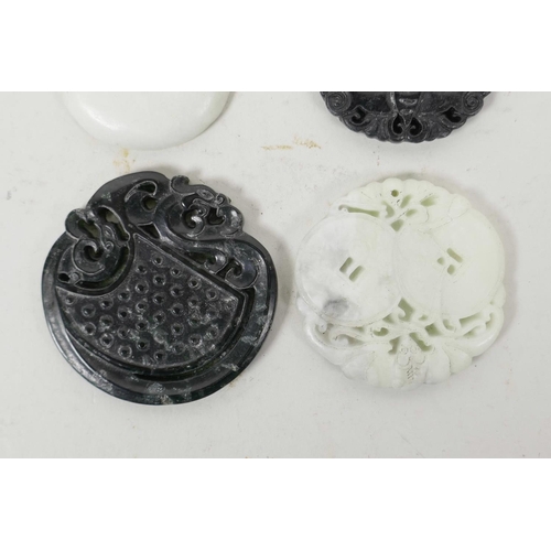 5 - Four Chinese carved hardstone pendants decorated with auspicious animals and symbols, 2