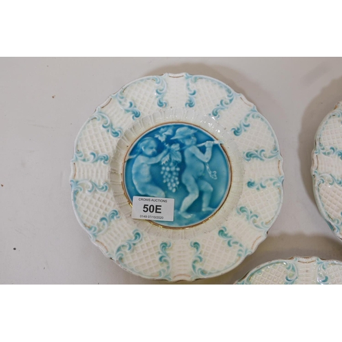 50E - Three C19th French faience plates with putti decoration, in the style of Rupelle, impressed to base ... 