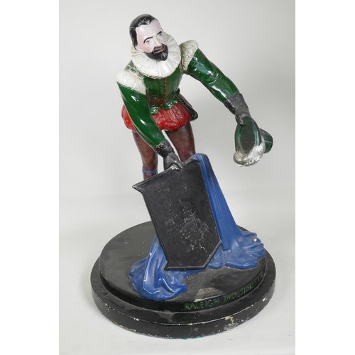 50F - A wood and plaster Raleigh Cycles advertising model, modelled as a figure with hat in hand holding a... 