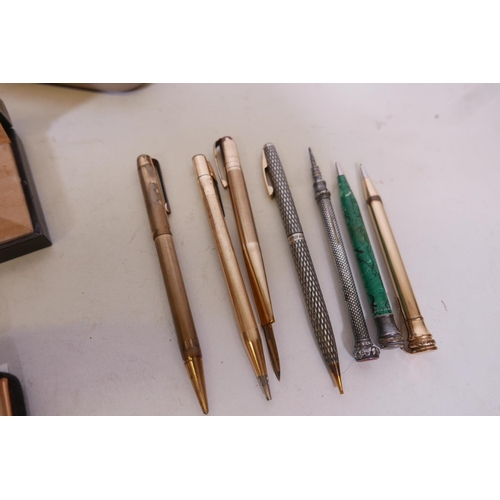 50G - A collection of ball pens, Cross, Sheaffer, Dupont, and propelling pencils, a K knife retracting let... 