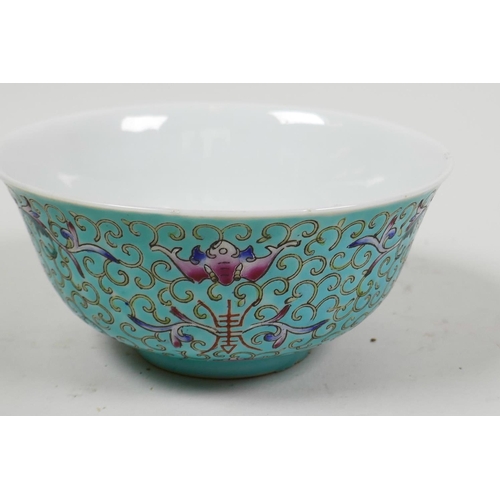 53 - A Chinese porcelain rice bowl painted with bats and flowers on a turquoise ground, 5¼