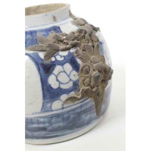 6 - An antique Chinese blue and white storage jar with applied dragon mask decoration and painted with s... 