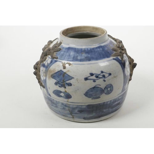 6 - An antique Chinese blue and white storage jar with applied dragon mask decoration and painted with s... 