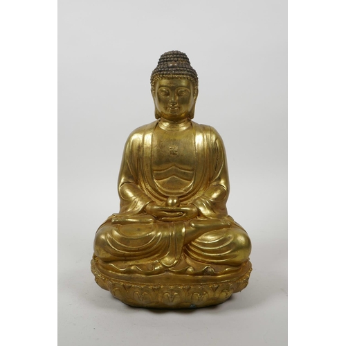 60 - A Chinese gilt bronze of Buddha seated in meditation on a lotus throne, 10