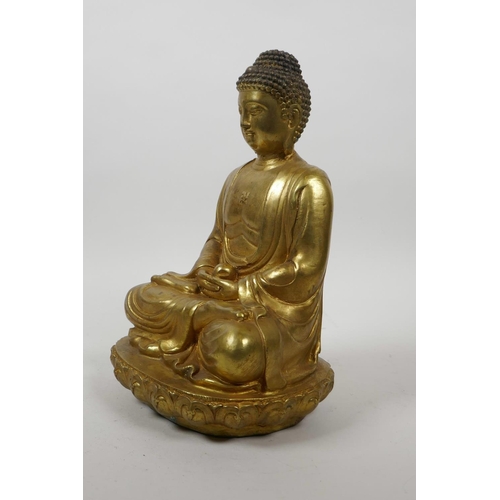 60 - A Chinese gilt bronze of Buddha seated in meditation on a lotus throne, 10