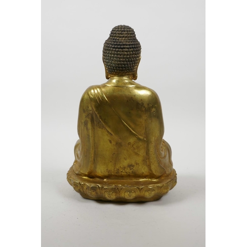 60 - A Chinese gilt bronze of Buddha seated in meditation on a lotus throne, 10