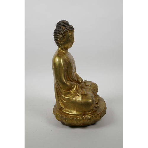 60 - A Chinese gilt bronze of Buddha seated in meditation on a lotus throne, 10