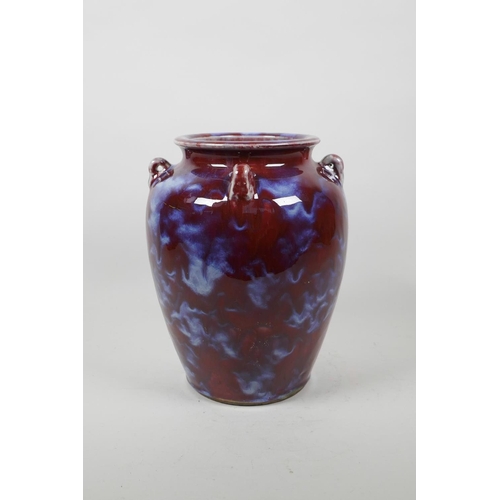 63 - A Chinese pottery vase with four lug handles and a Jun ware style glaze, 4 character mark to base, 9... 