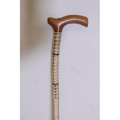 65 - A 19C shark vertebrae walking stick, 34