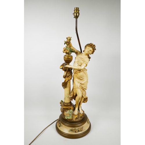 67 - A painted spelter lamp in the form of a classical maiden, 30