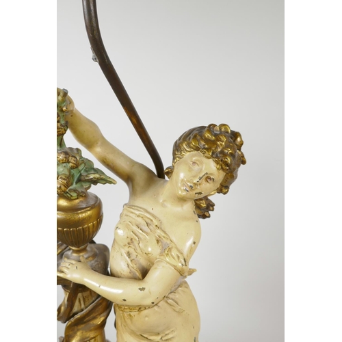 67 - A painted spelter lamp in the form of a classical maiden, 30