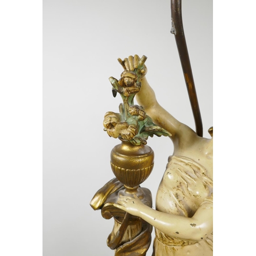 67 - A painted spelter lamp in the form of a classical maiden, 30