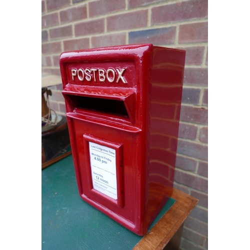 11 - A cast metal and steel postbox, 17½