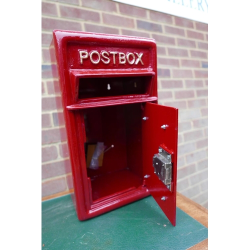 11 - A cast metal and steel postbox, 17½