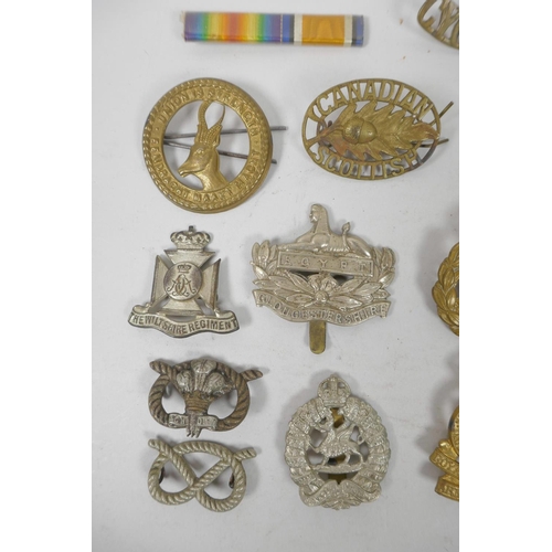 12 - A quantity of assorted British Forces and other service badges