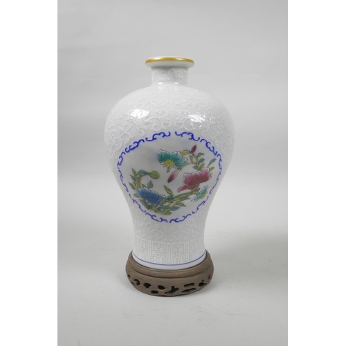 20 - A Chinese porcelain meiping vase with decorative famille verte enamelled panels depicting flowers in... 