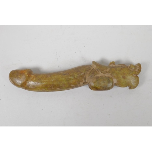 26 - A Chinese carved hardstone phallic ornament with a dragon shaped handle, 8½