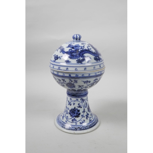 35 - A Chinese blue and white porcelain stem bowl and cover, with scrolling lotus flower, dragon and phoe... 