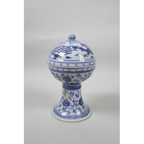 35 - A Chinese blue and white porcelain stem bowl and cover, with scrolling lotus flower, dragon and phoe... 