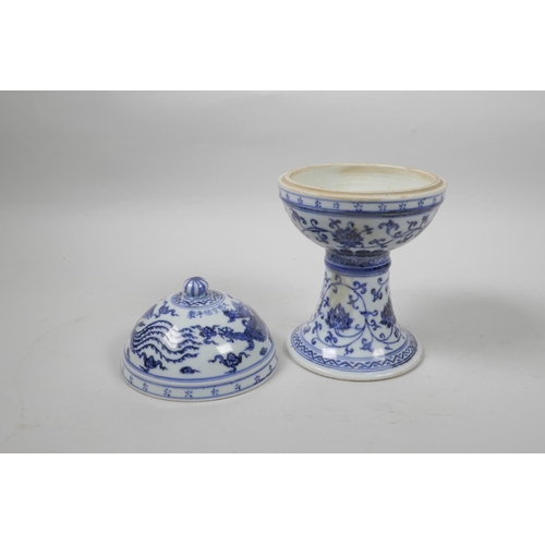 35 - A Chinese blue and white porcelain stem bowl and cover, with scrolling lotus flower, dragon and phoe... 