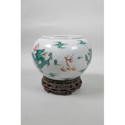 50 - A late C19th/early C20th Chinese famille verte porcelain bowl decorated with green enamel dragons ch... 