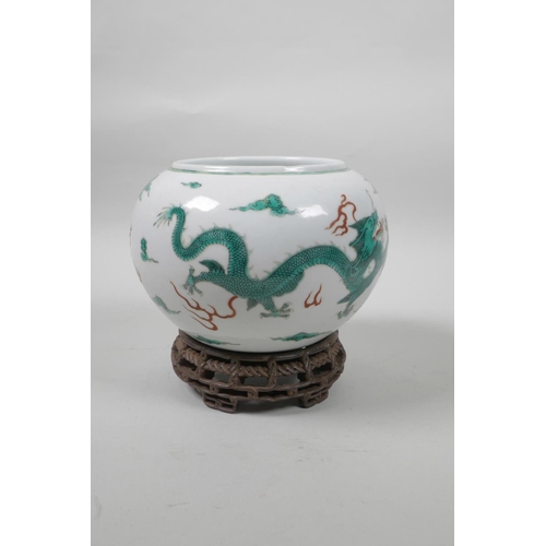 50 - A late C19th/early C20th Chinese famille verte porcelain bowl decorated with green enamel dragons ch... 