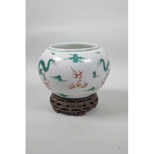 50 - A late C19th/early C20th Chinese famille verte porcelain bowl decorated with green enamel dragons ch... 