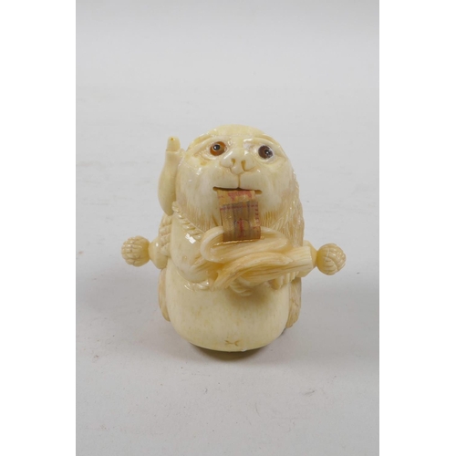 51 - A bone tape measure carved in the form of a bear, 2