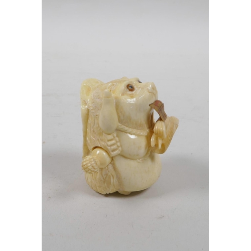 51 - A bone tape measure carved in the form of a bear, 2