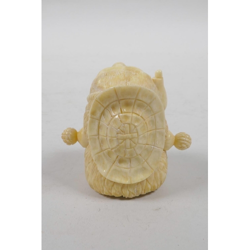 51 - A bone tape measure carved in the form of a bear, 2