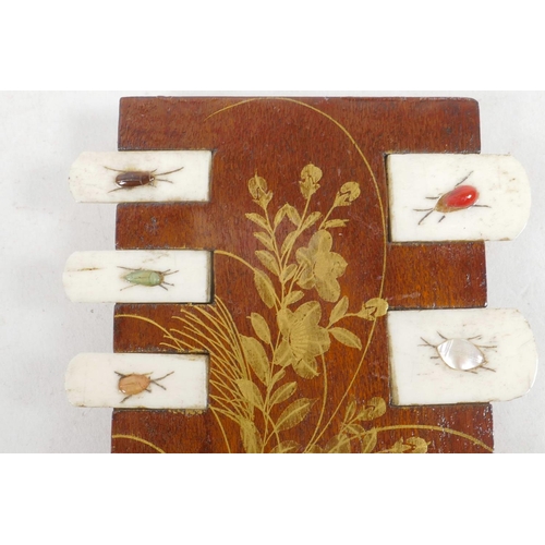 54 - An Oriental hardwood and bone games marker, decorated with shibayama insects, 3½