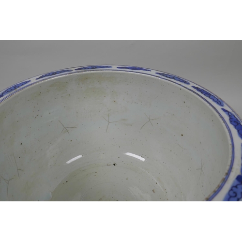 58 - A Chinese blue and white porcelain jardiniere decorated with figures in a landscape, star cracks to ... 