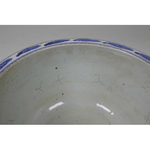 58 - A Chinese blue and white porcelain jardiniere decorated with figures in a landscape, star cracks to ... 