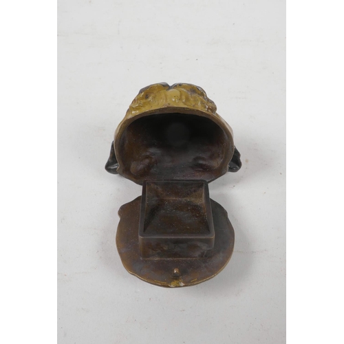 8 - A cold painted bronze stamp box in the form of a pug's head, 2½