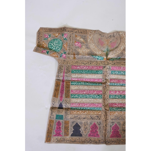 14 - An Islamic linen robe with all over calligraphic decoration, 34