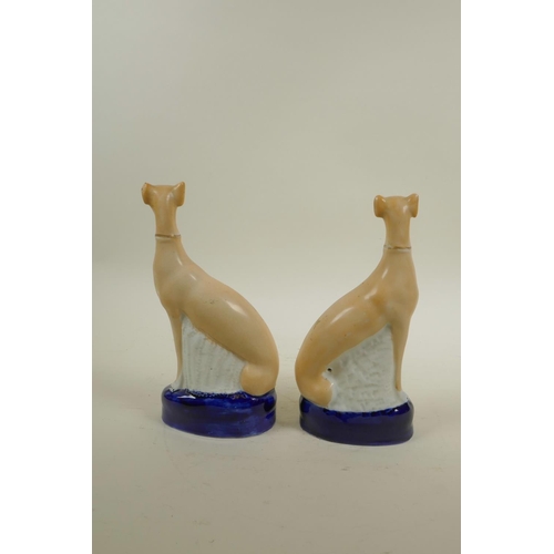 11 - A pairof Staffordshire pottery greyhounds, 8½