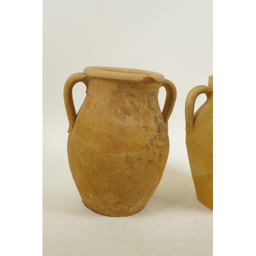 12 - A pair of continental terracotta two handled jars, 8